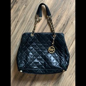Michael Kors black quilted gold shoulder handbag